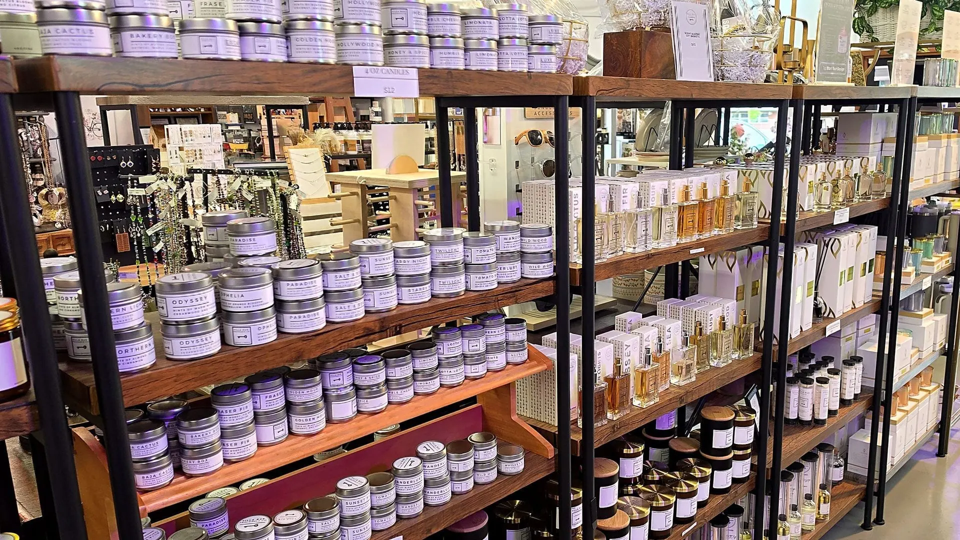 A wall of Villa Rue candles glowing in the Stellar Luxe shop